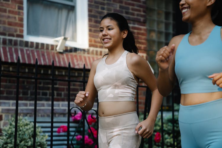 Happy Women Jogging Together