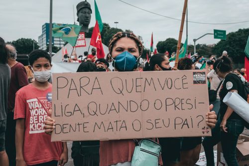 Free Large gathering in Rio de Janeiro, Brazil, featuring protestors holding signs against government policies. Stock Photo