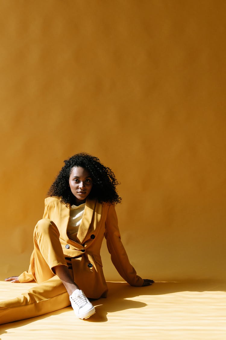 A Woman Wearing Yellow Blazer And Yellow Pants