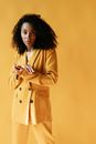 Woman in Brown Coat Standing and Smiling