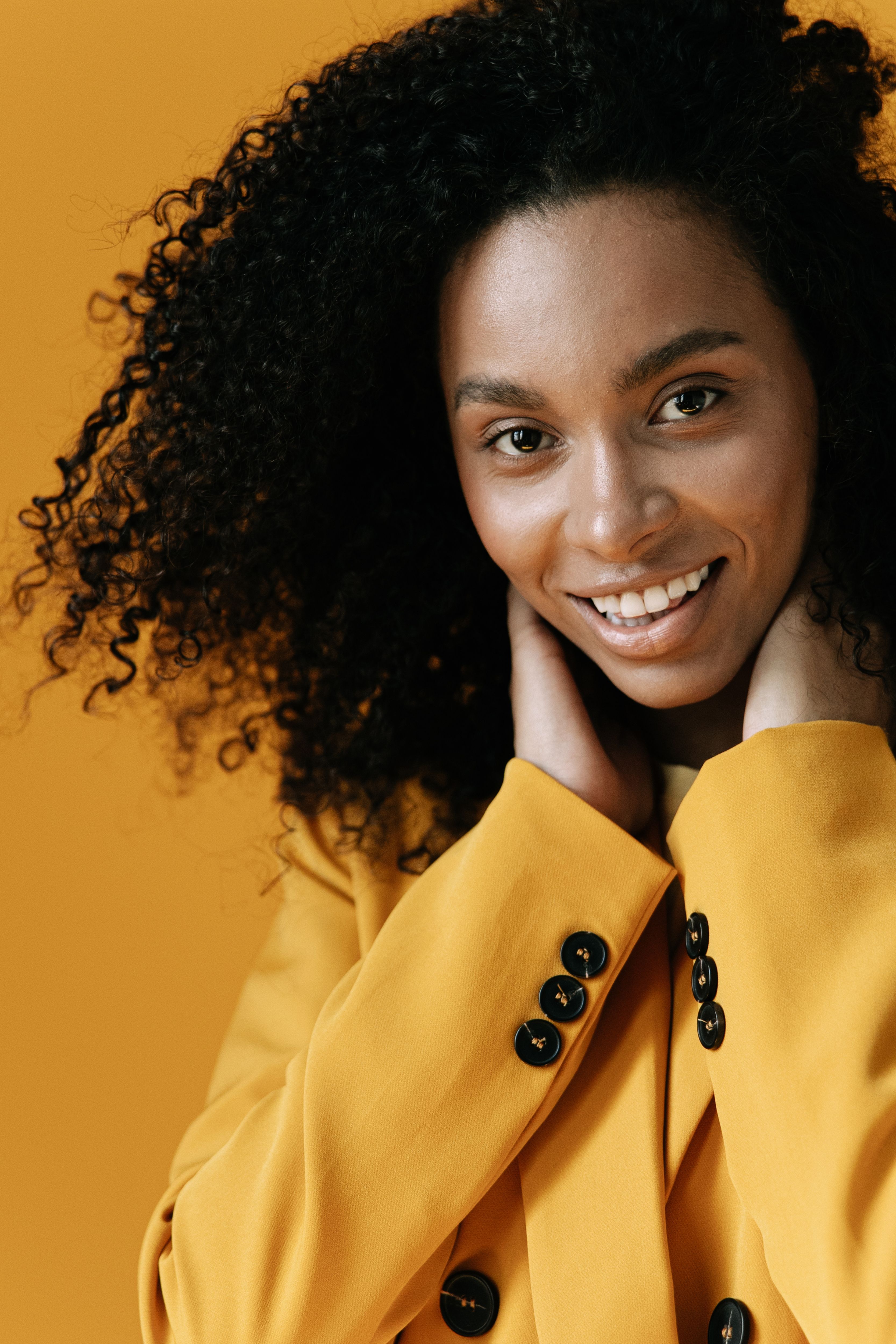 Woman in Yellow Blazer Smiling · Free Stock Photo