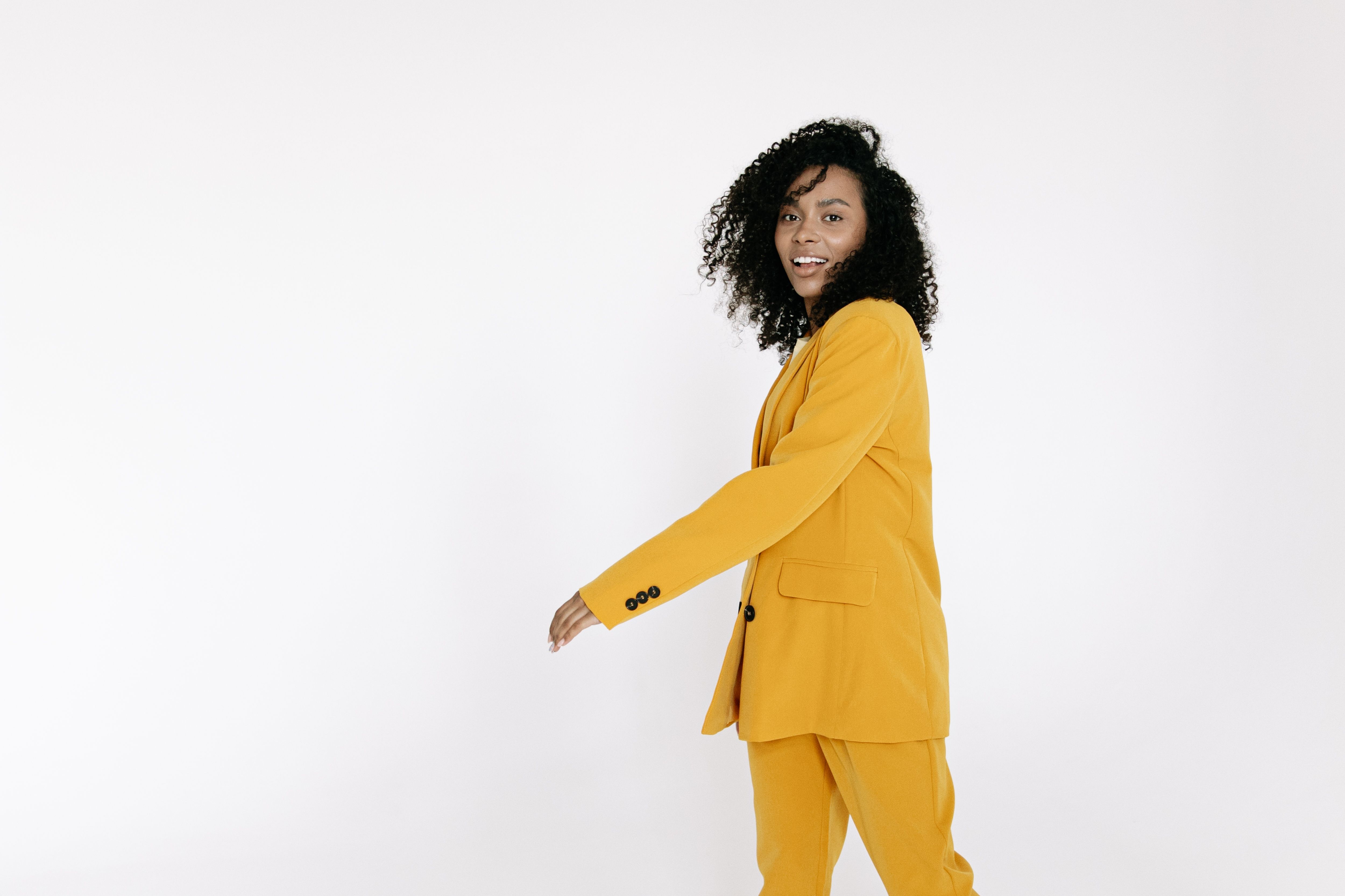 Woman in Yellow Suit Smiling · Free Stock Photo