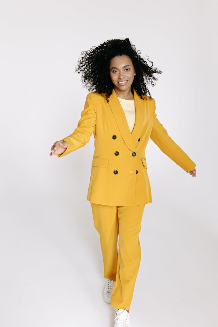 Woman In Yellow Suit And Yellow Pants