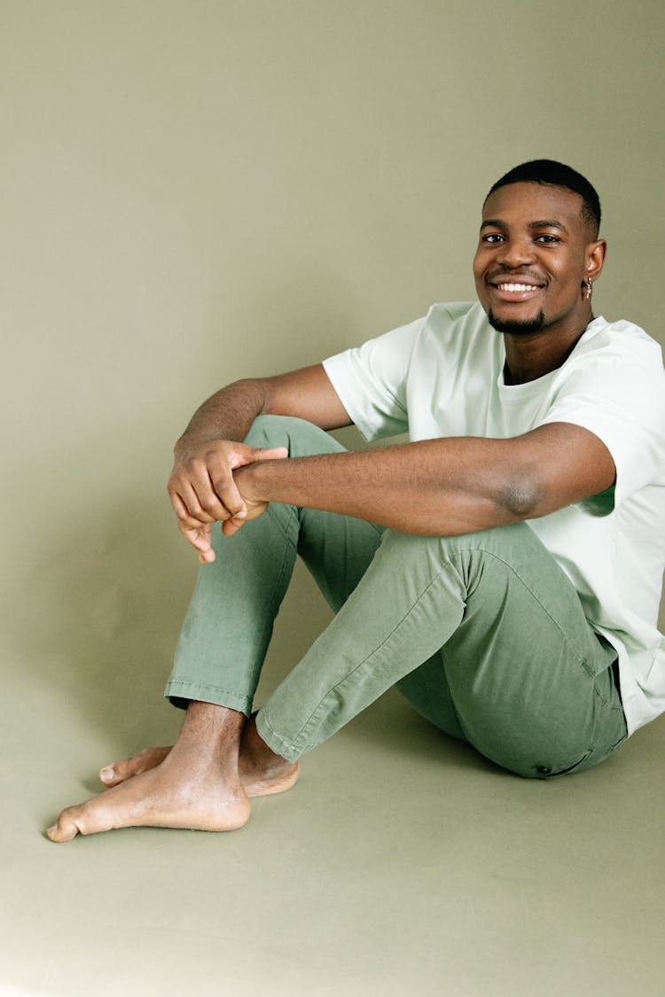 A Man In Green Shirt And Green Pants