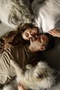 A Couple and Their Dogs Sleeping on the Floor