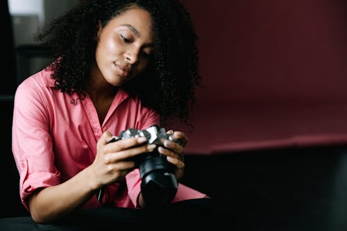 A Woman Holding a Camera 