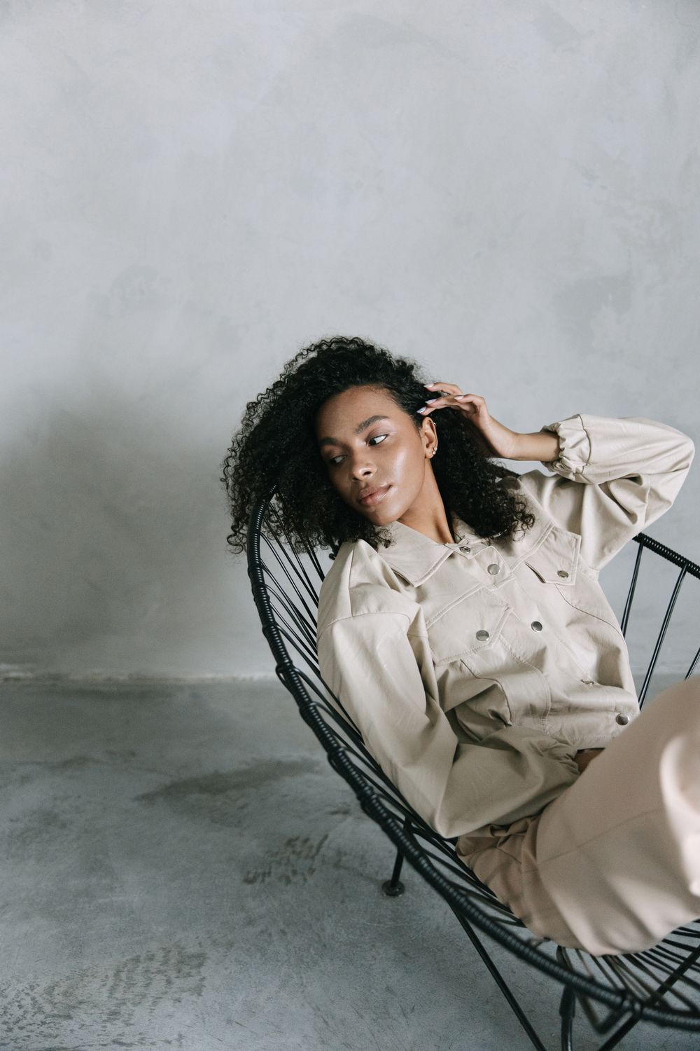 A Woman in Brown Jacket Sitting on the Chair · Free Stock Photo
