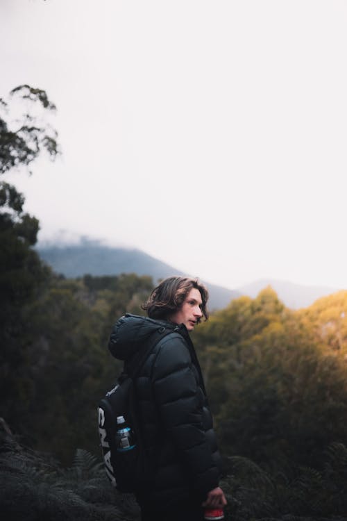 Man in Black Jacket Standing on Mountain