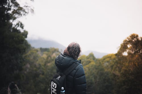 Man Standing on a Mountain