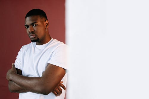 A Man in White Shirt with His Arms Crossed