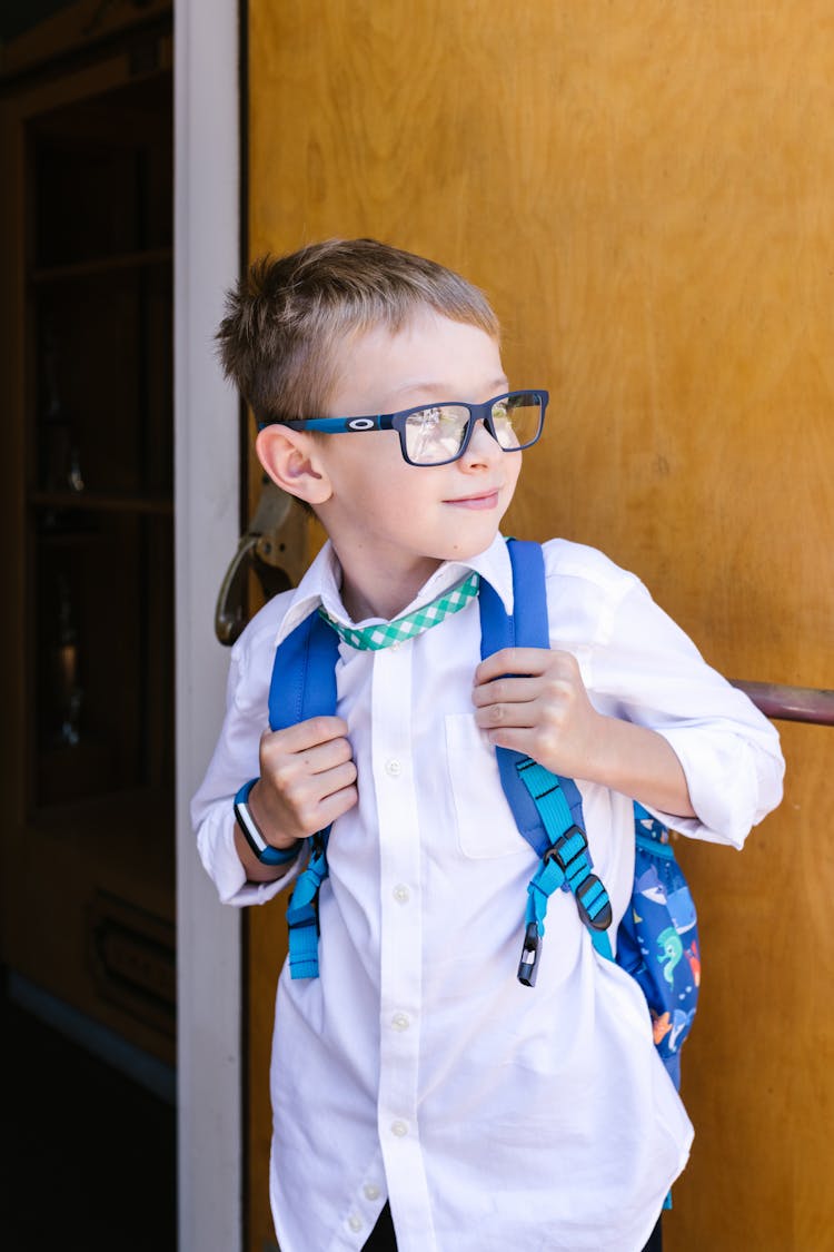 Young Boy Wearing Blue Backpack