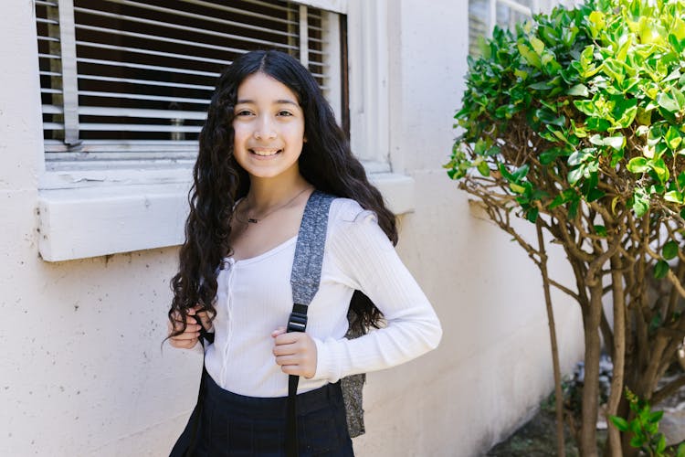 Young Lady Wearing A Backpack