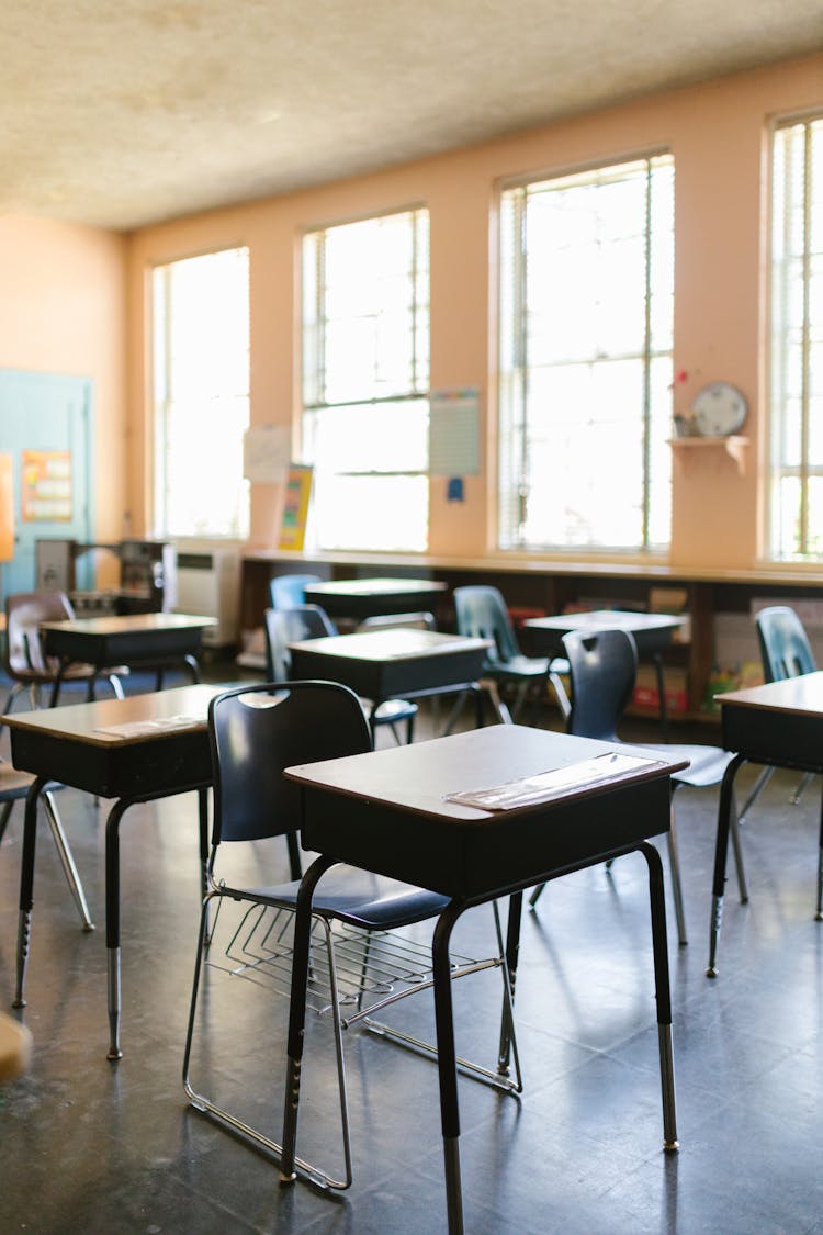 Desks And Chairs In Classroom