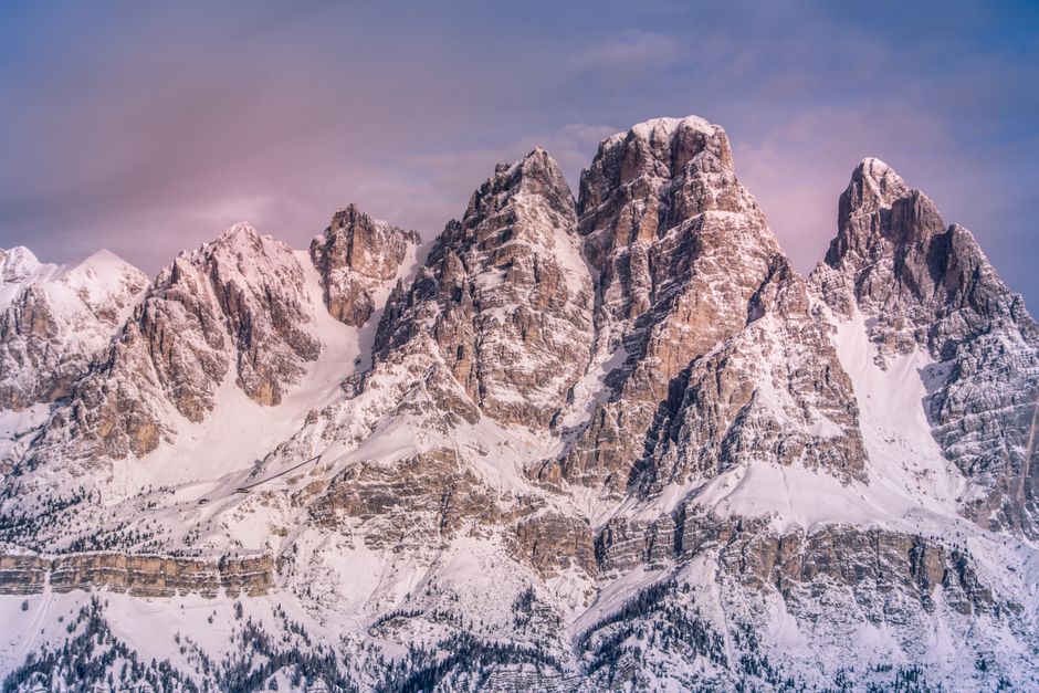 Snow-covered peaks of the Dolomites in Italy during winter, ideal for skiing