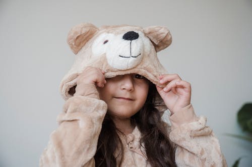 A Young Girl Wearing Bear Costume