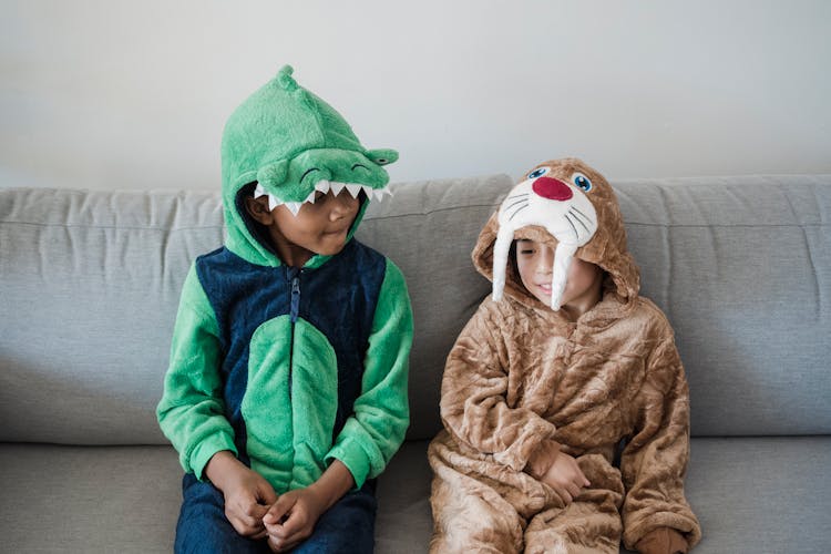 Boys In Onesies Sitting Together