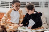 Kids in Animal Costume Reading Book