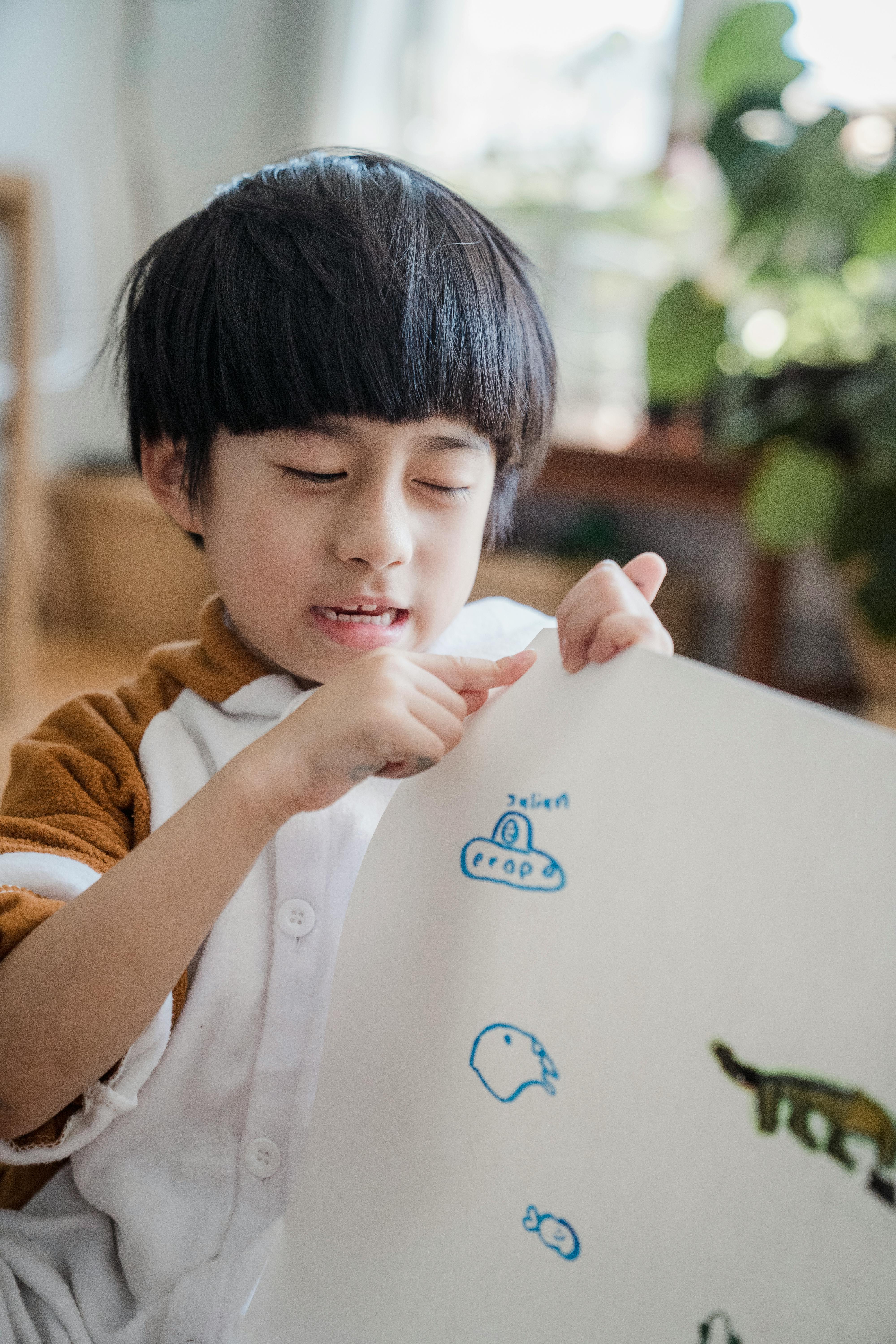 portrait of boy learning and drawing