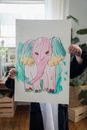 Kid Holding Drawing of Pink Elephant