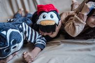 Kids in Pyjamas Lying on Bed