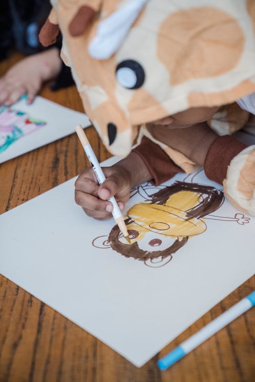 Boy Drawing a Monkey