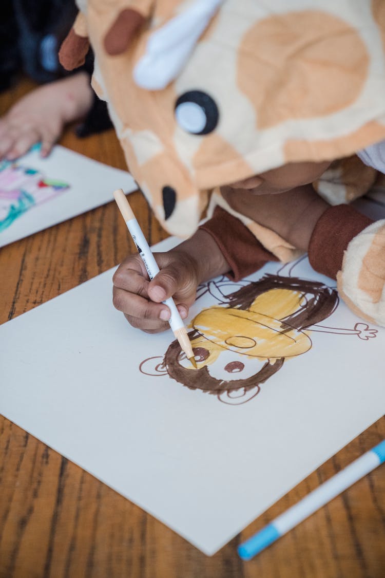 Boy Drawing A Monkey