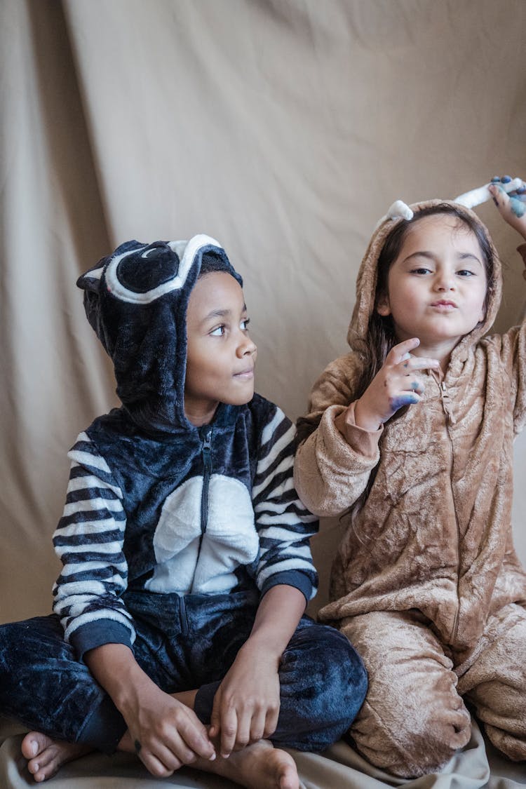 Photograph Of Kids Wearing Onesies