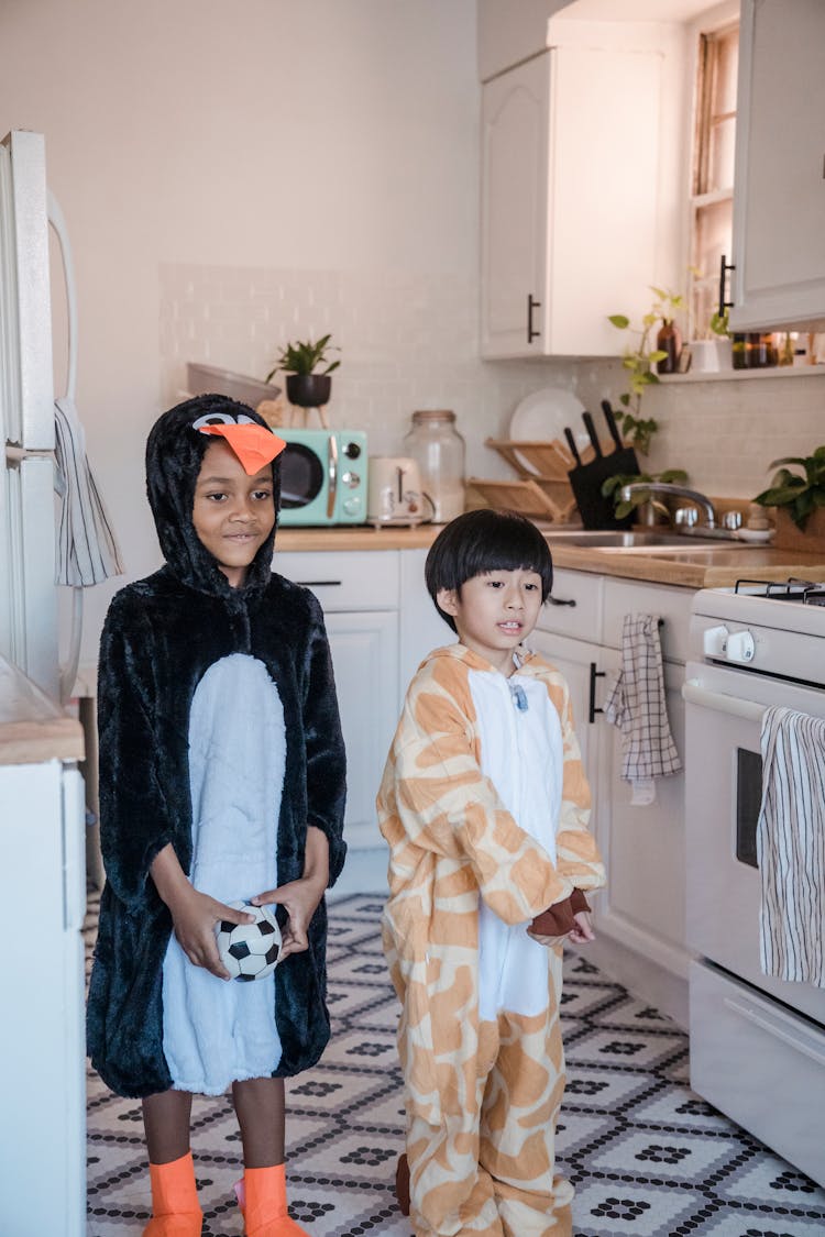 Boys Wearing Onesies In The Kitchen 