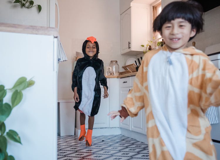 Happy Kids In Animal Costumes Running Around The House 