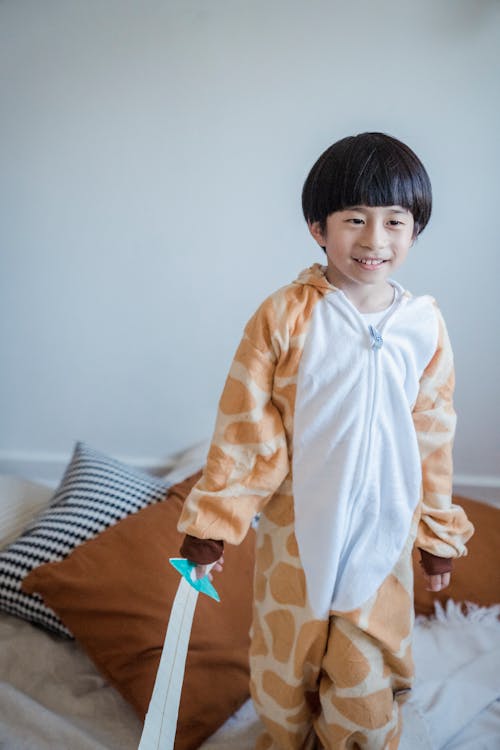Free A Boy Playing the Paper Sword he is Holding Stock Photo