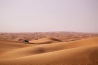 Person Riding an ATV on a Desert