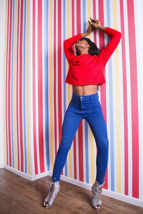 Woman Wearing Long-sleeve Crop-top and Blue Pants