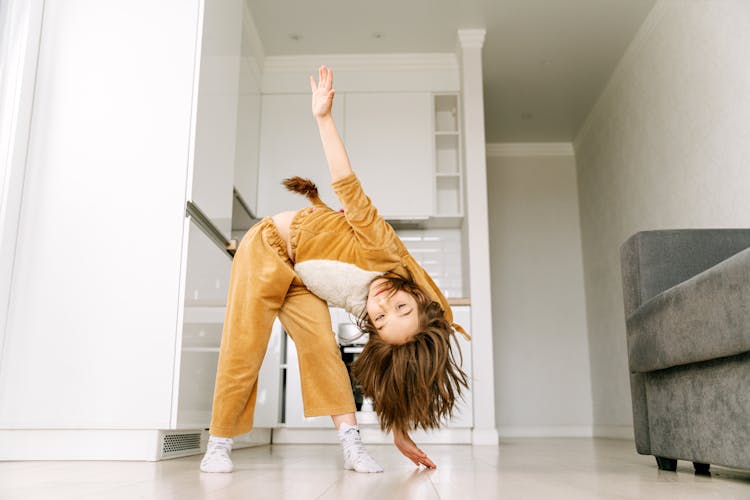 Photograph Of A Kid Dancing