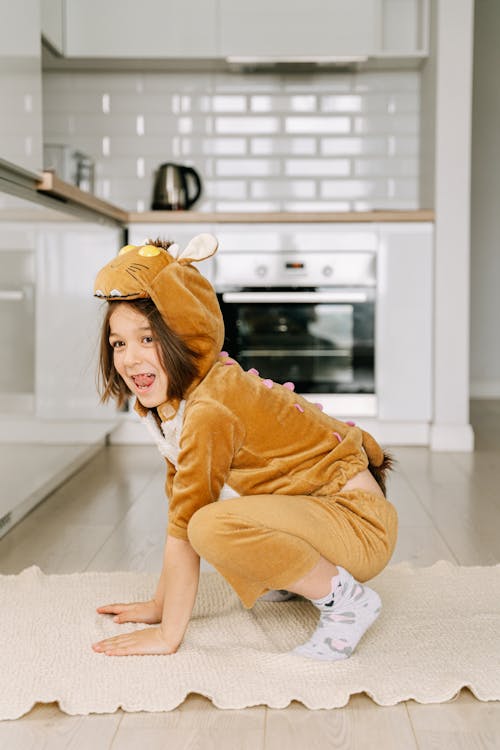 Free A Boy in Brown Pajamas Playing Stock Photo