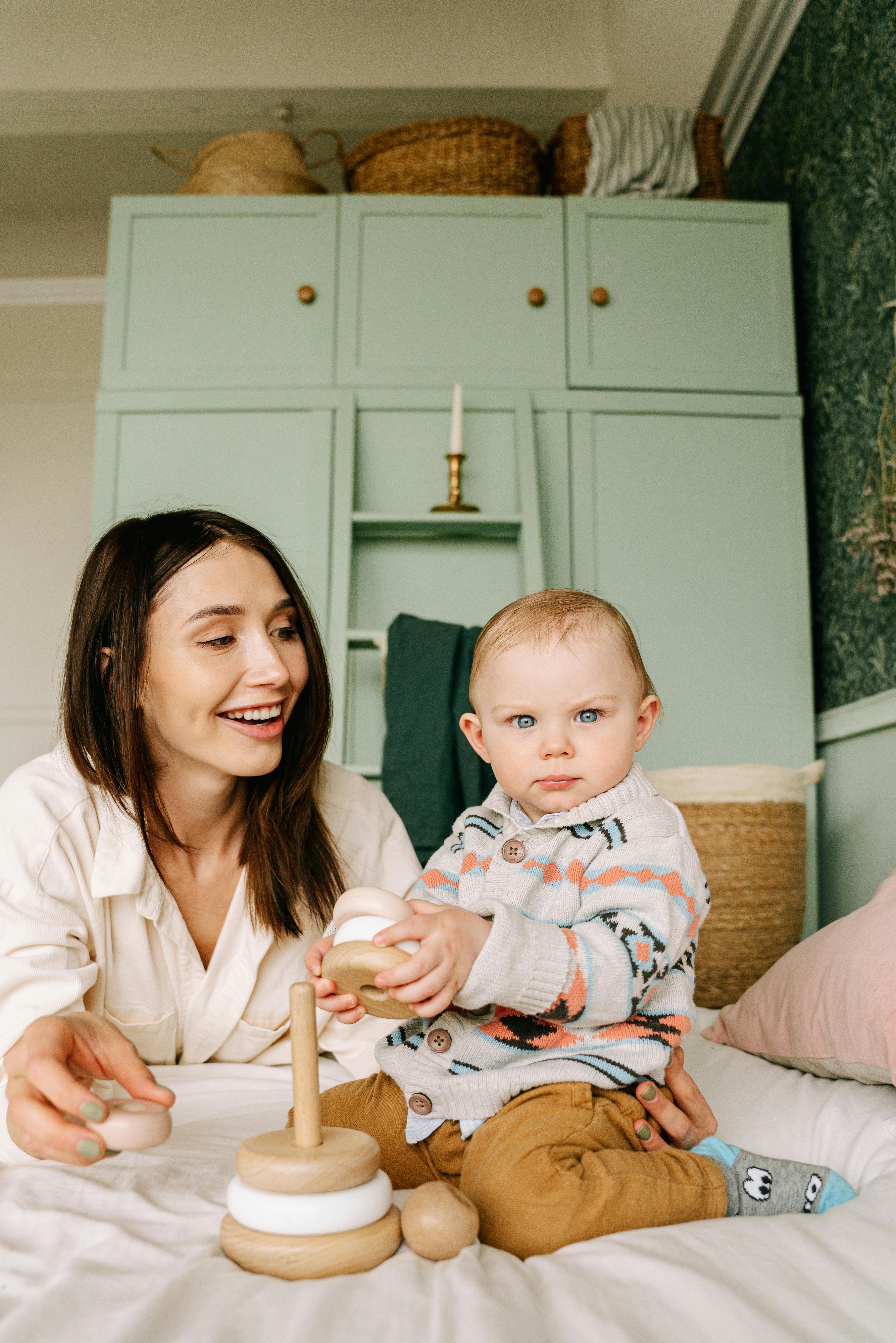 A Woman Combing the Hair of a Baby Girl · Free Stock Photo A Woman Combing the Hair of a Baby Girl · Free Stock Photo