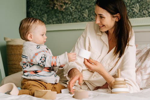 A Baby Playing Wooden Toys