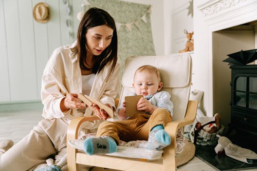 Woman Showing a Baby a Toy