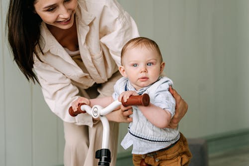 A Baby Biking inside the House