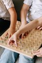 Close-Up Photo of Kids Playing Geoboard