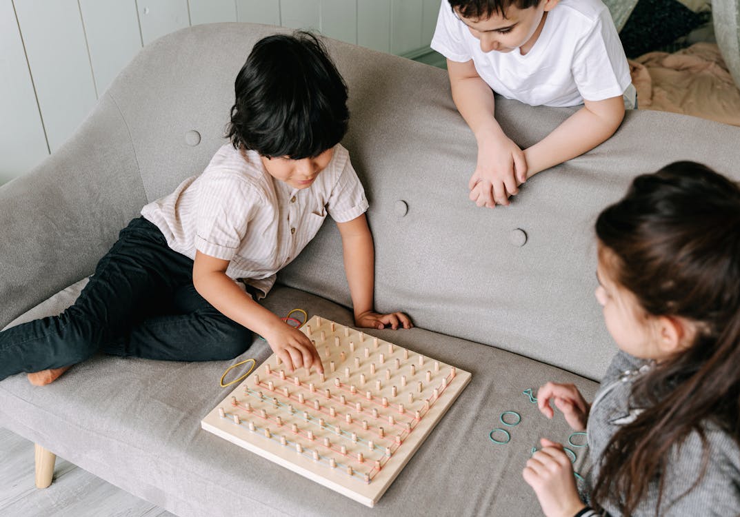 Free Kids Playing a Board Game Stock Photo