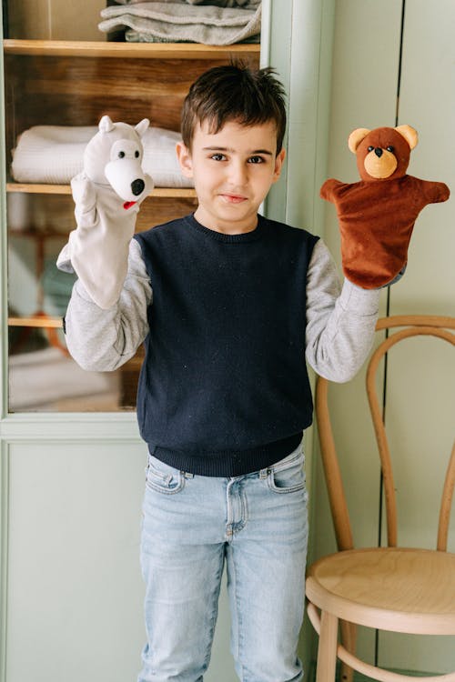 A Boy Playing Puppets