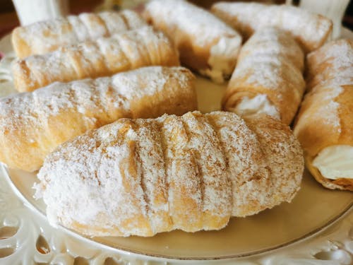 Close-Up Photo of Delicious Bread Covered with Powdered Sugar
