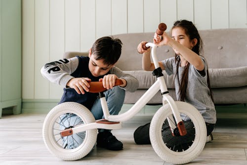 Kids Fixing a Bicycle