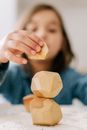 Shallow Focus Photo of a Kid Playing Wooden Blocks