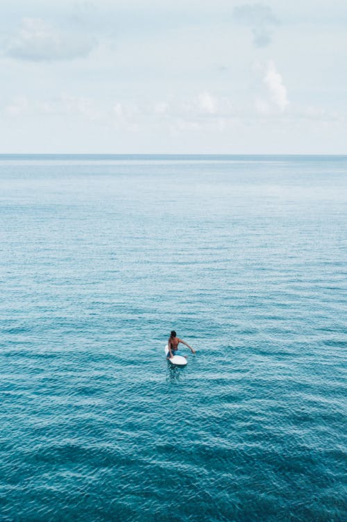 Aerial View of Person Surfing on Sea