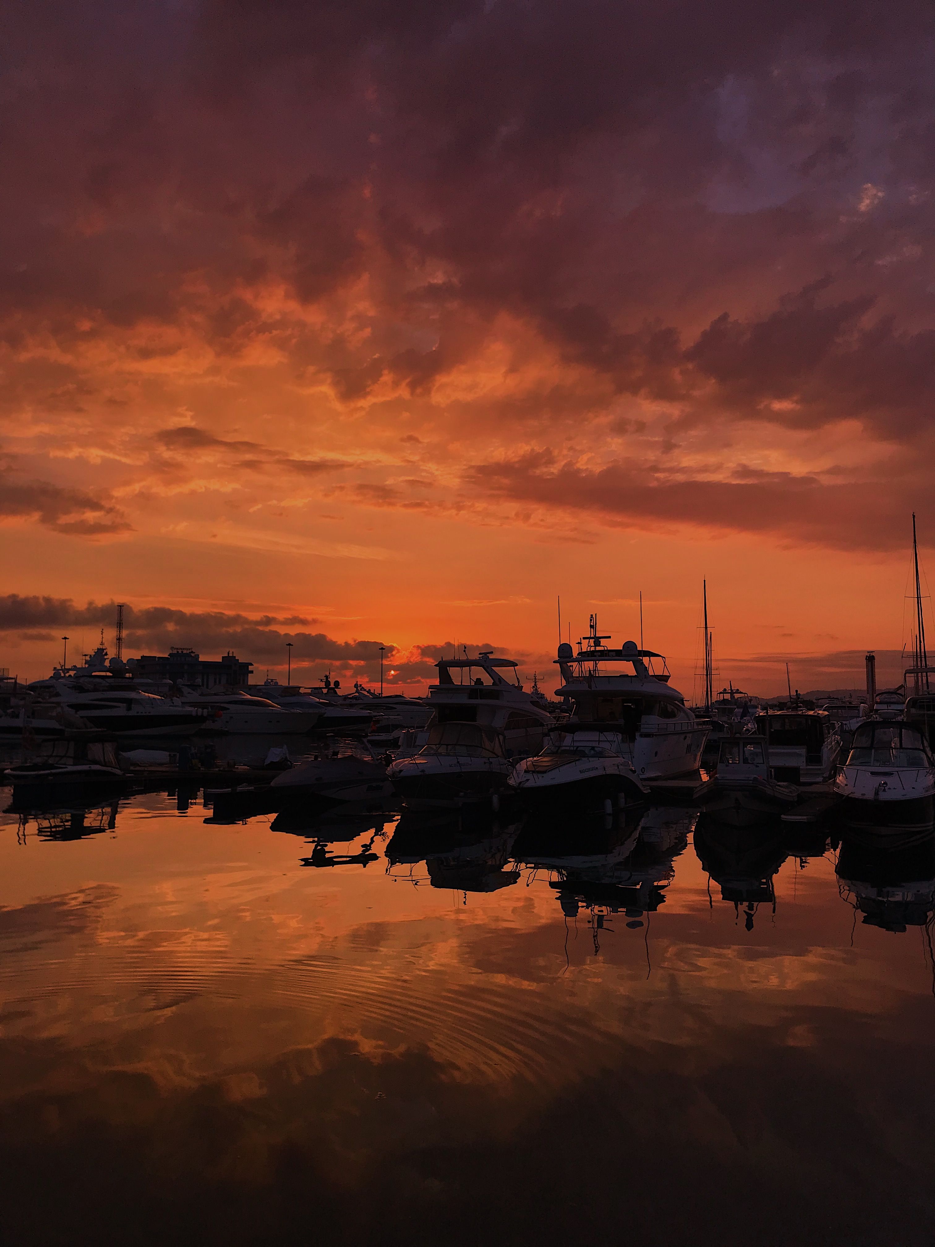 Silhouette of Boats on Water during Golden Hour · Free Stock Photo