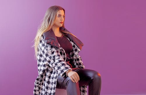 A Fashionable Woman on Light Purple Background