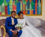 A Newlywed Couple Sitting on Couch
