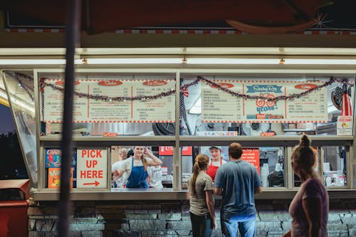 Man and Woman Ordering Food at a Fast Food Restaurant