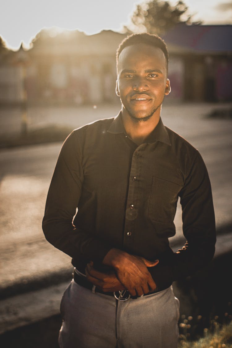 Shallow Focus Photo Of Man In Black Dress Shirt Smiling